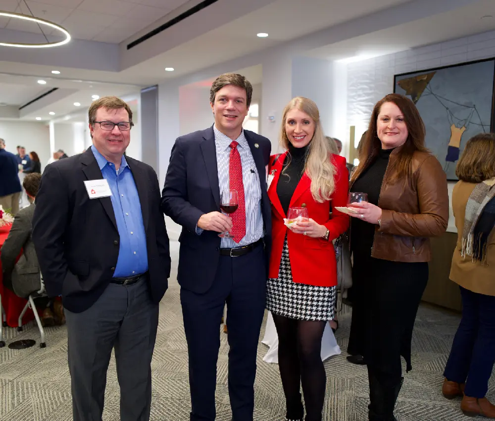 group of people standing smiling