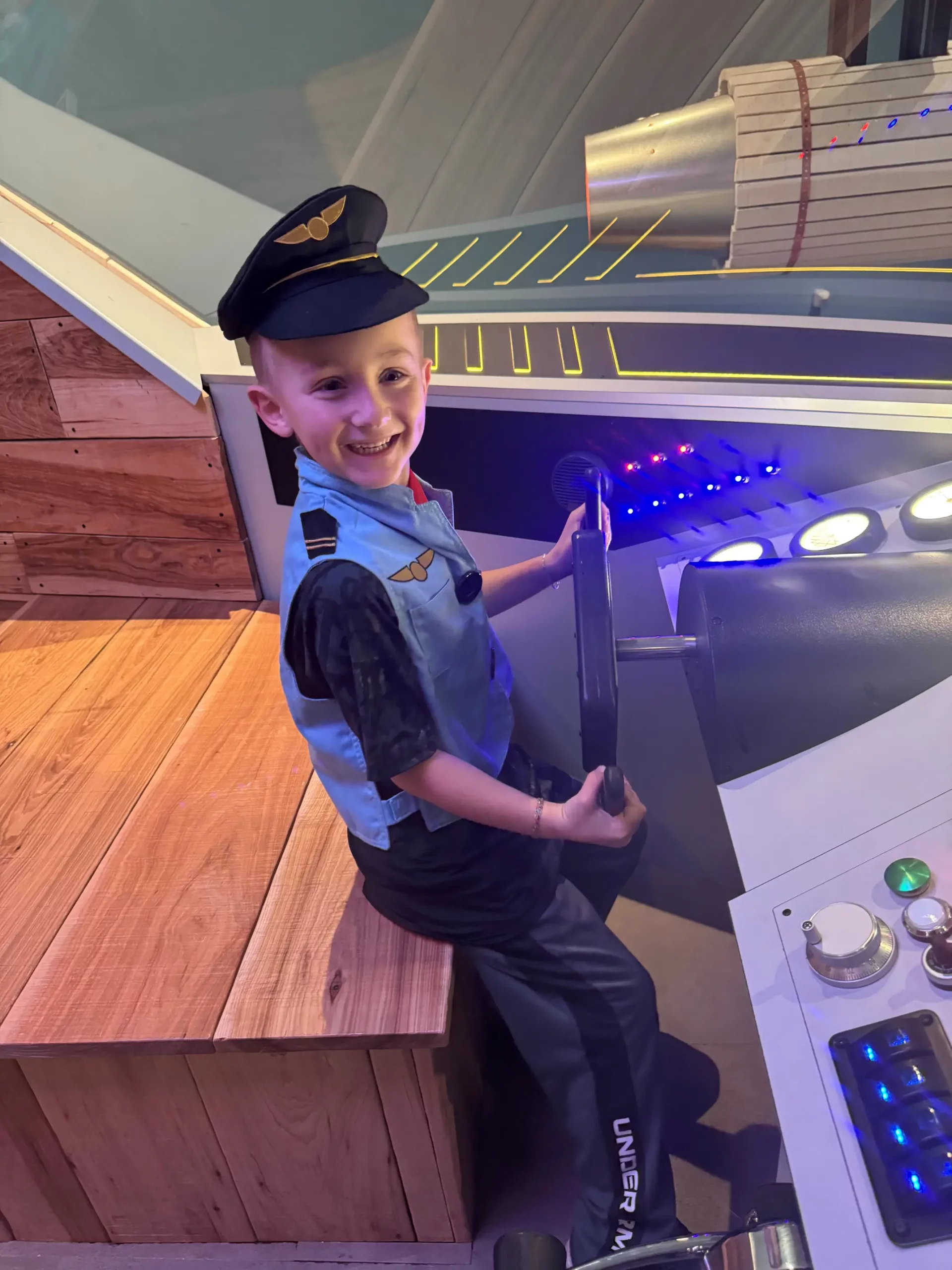 boy flying fake airplane