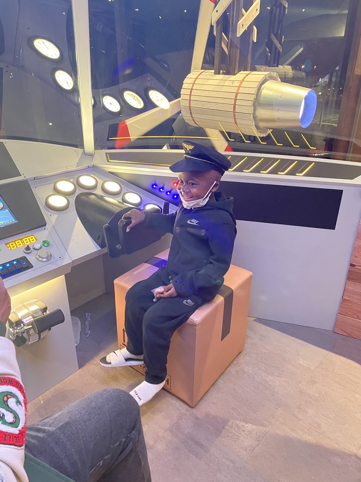 boy sitting on box in plane