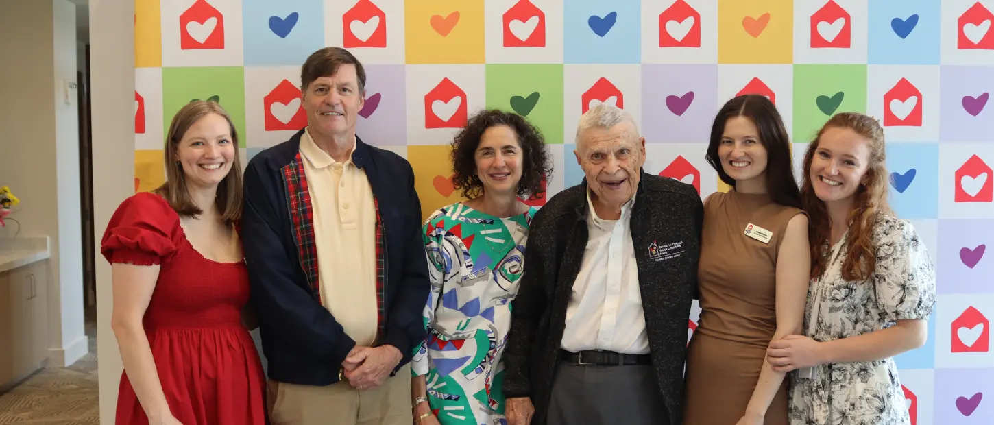 group of people standing smiling