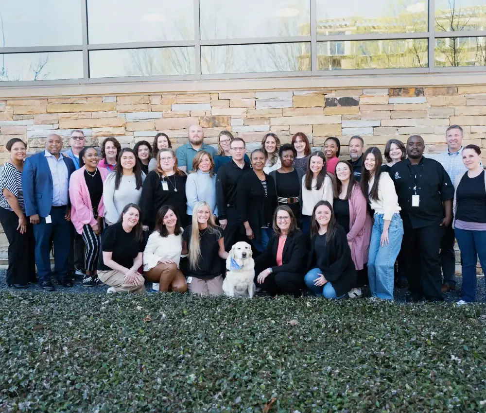 group of people standing in front of building