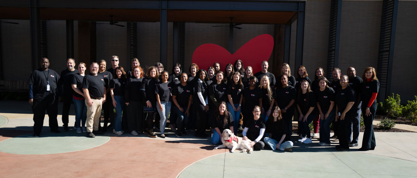 group of people standing and smiling