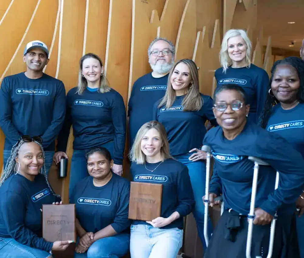 Group of people standing smiling