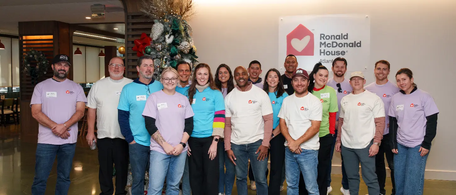 group of people standing smiling