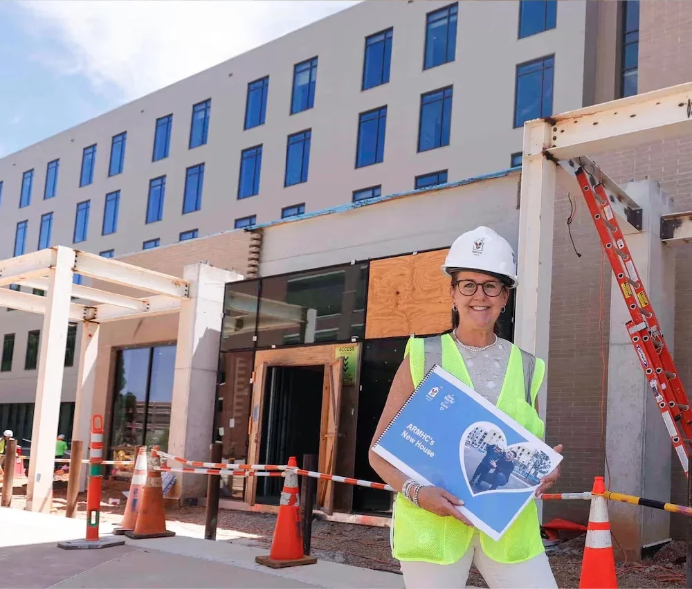 Tracey Atwater, president and CEO of Atlanta Ronald McDonald House Charities, stands in front of the construction site of a new Ronald McDonald House