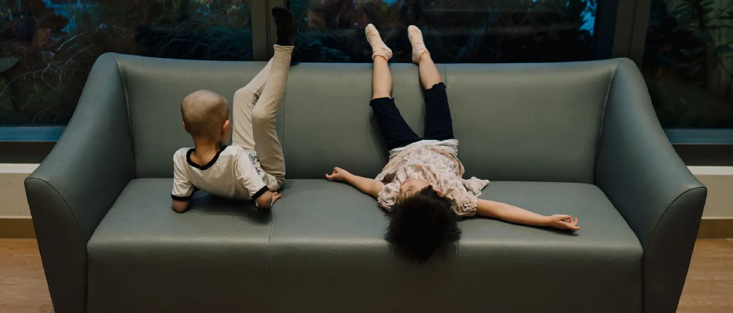 kids laying on couch