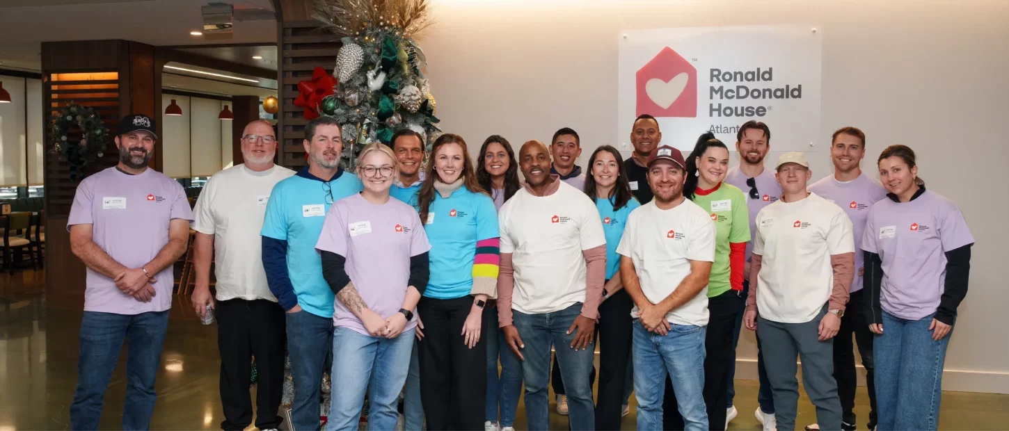 group of people standing smiling