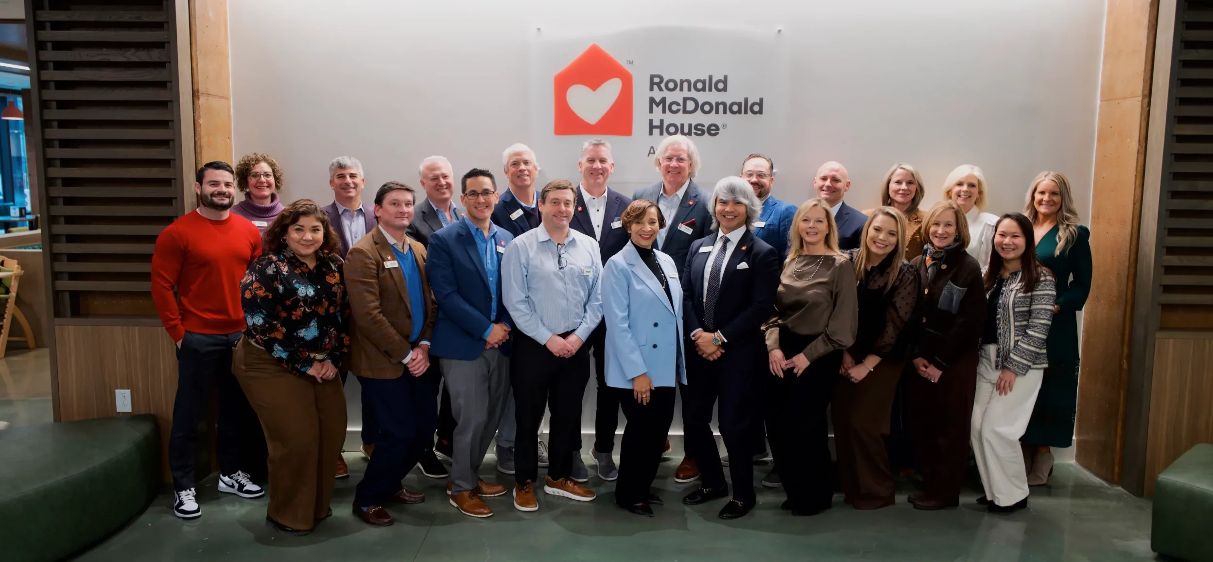 group of people standing in front of sign