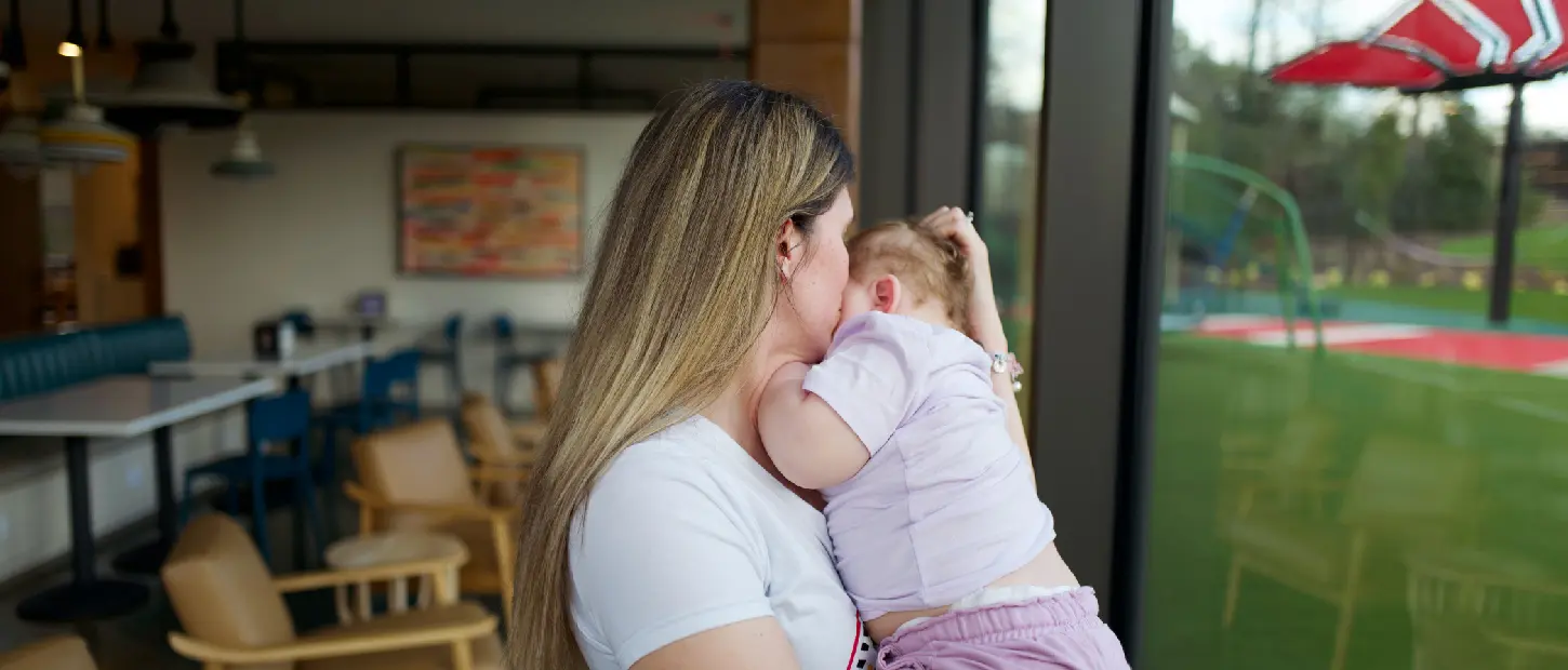 mom holding baby