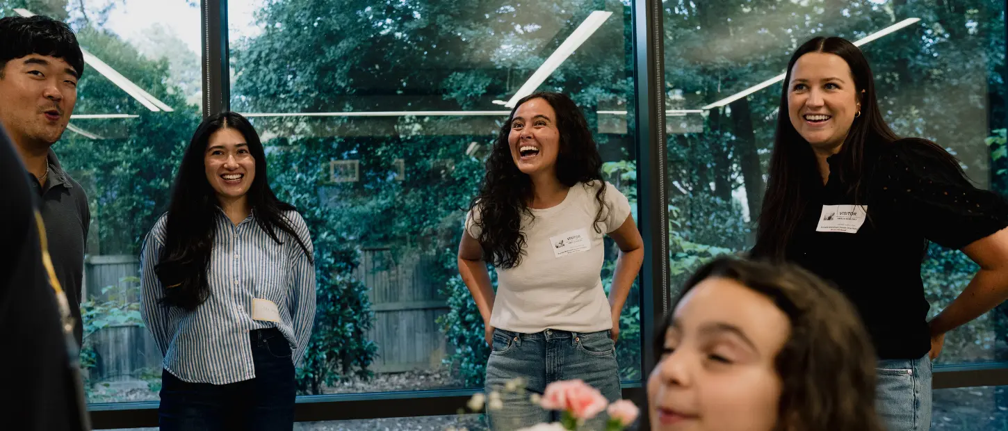 group of people smiling and laughing