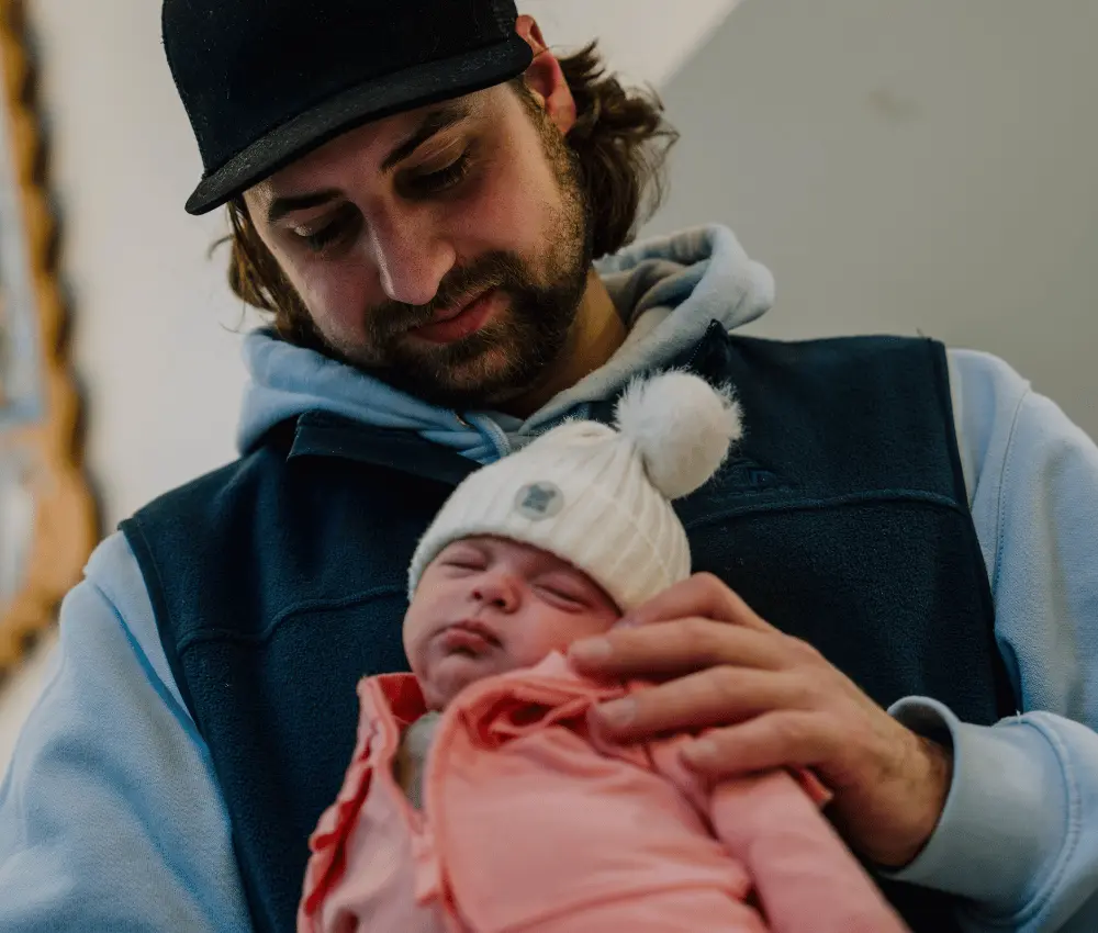 man holding baby