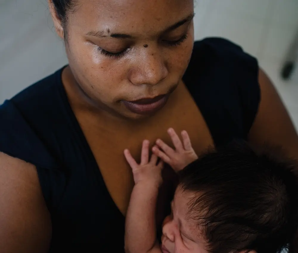 mom holding baby