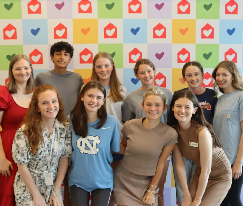 group of people standing smiling
