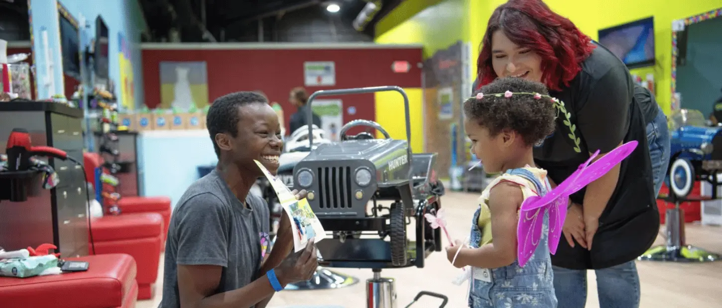 woman showing child a drawing