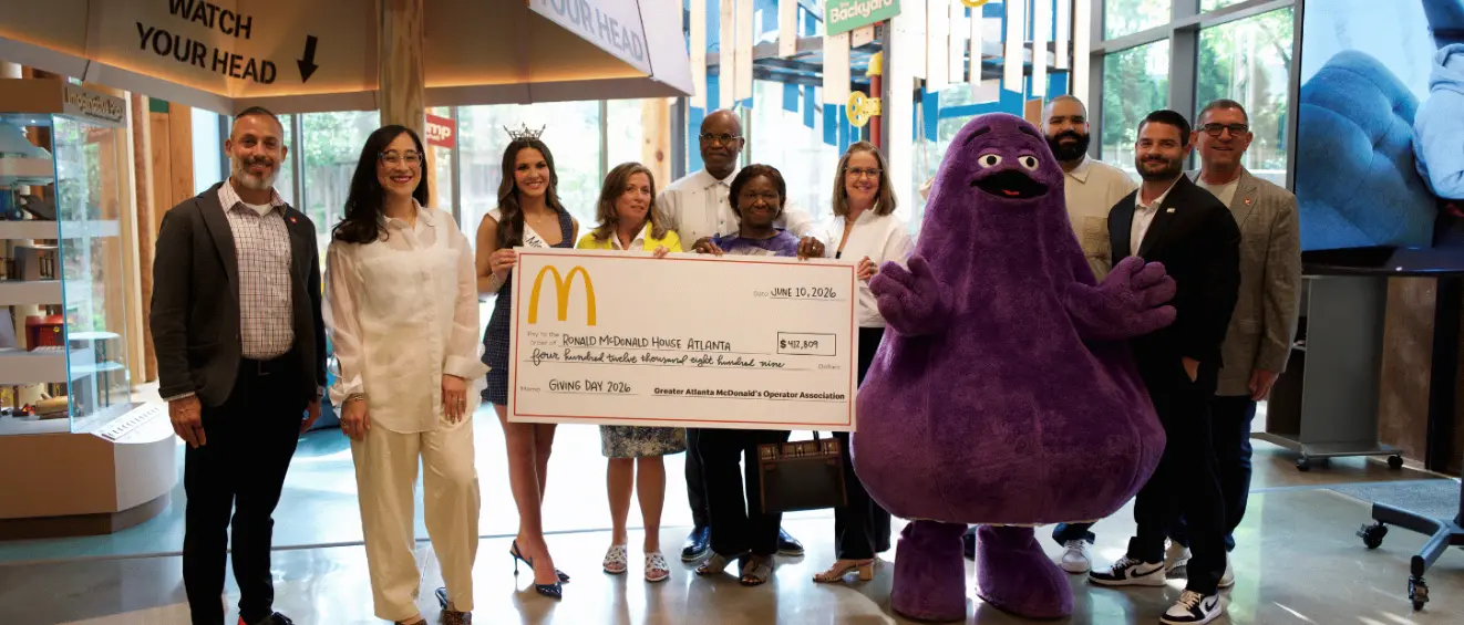 Group of people holding a check