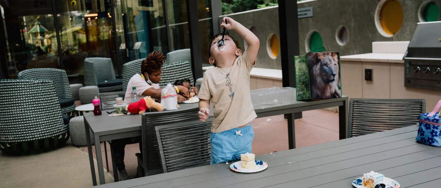 boy eating birthday cake