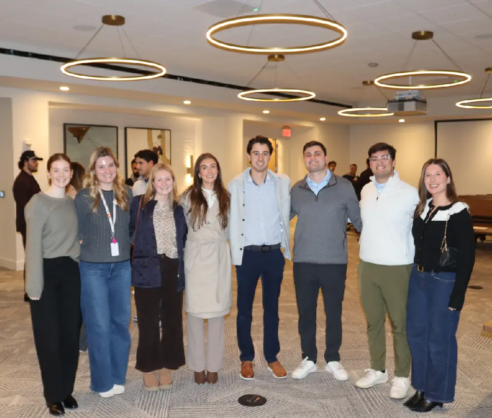 group of people standing smiling